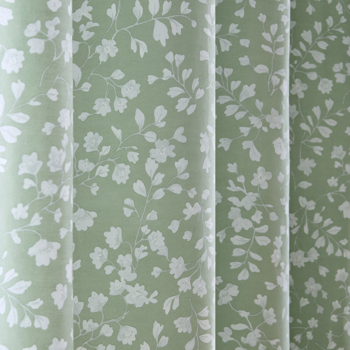 Catherine Lansfield Arla Floral Lined Eyelet Curtains in Green