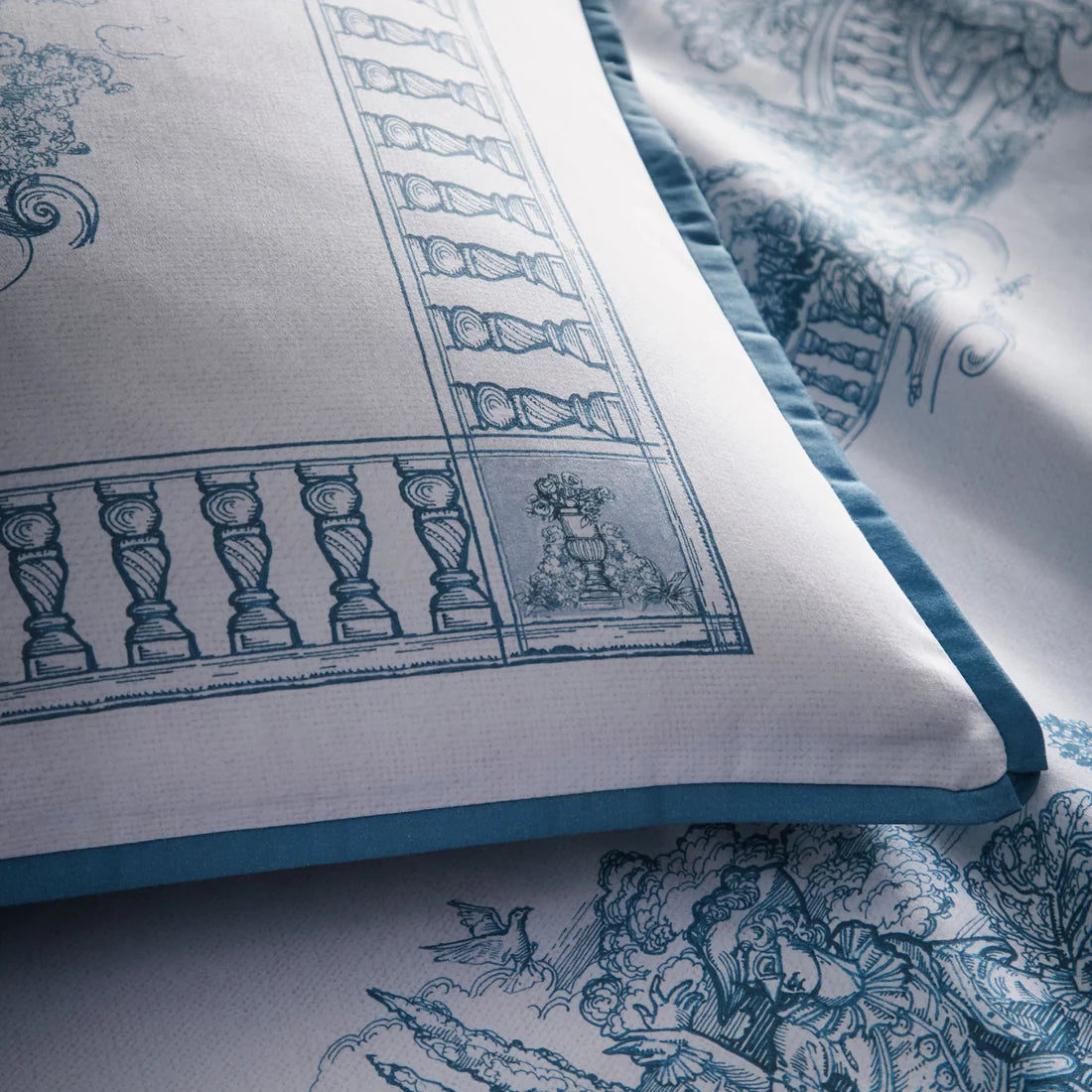 Close-up of the 100% cotton fabric and flat piped edging on the Tuscan Toile duvet cover set.