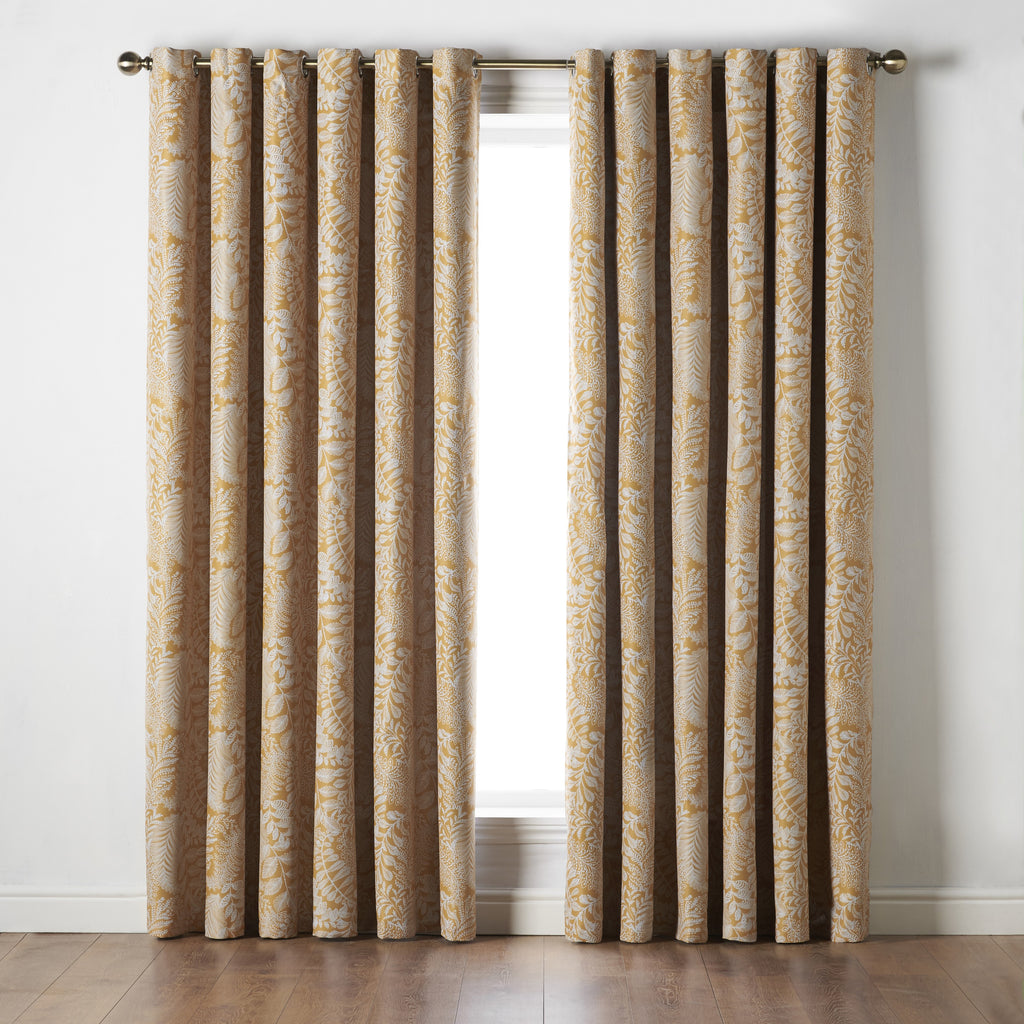 Ferndown Botanical Blackout Eyelet Curtains in Ochre