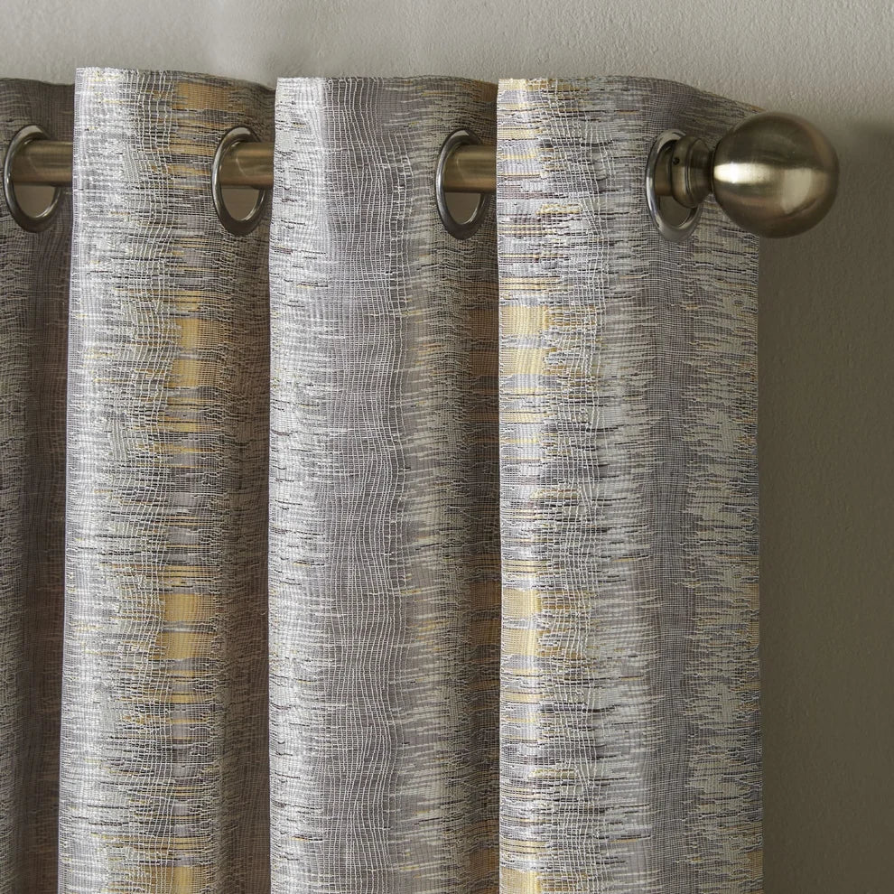 Reflections Eyelet Curtains in Ochre