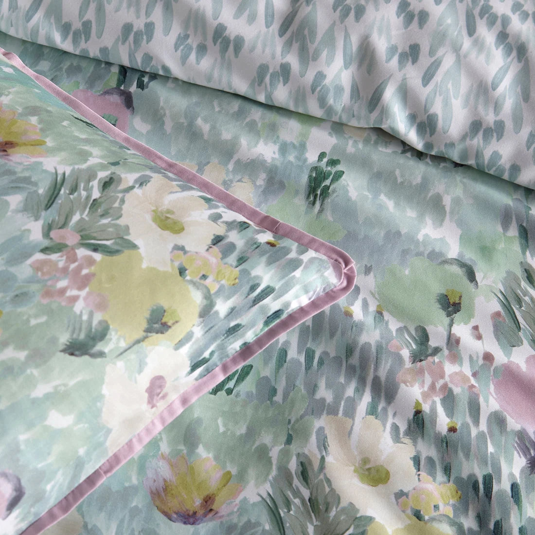 Close-up of the soft 100% cotton fabric and piped edging on the Appletree Abstract Floral duvet cover set.