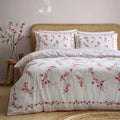 Appletree Blossom Flower duvet cover set in Berry with an elegant pink and berry floral design.