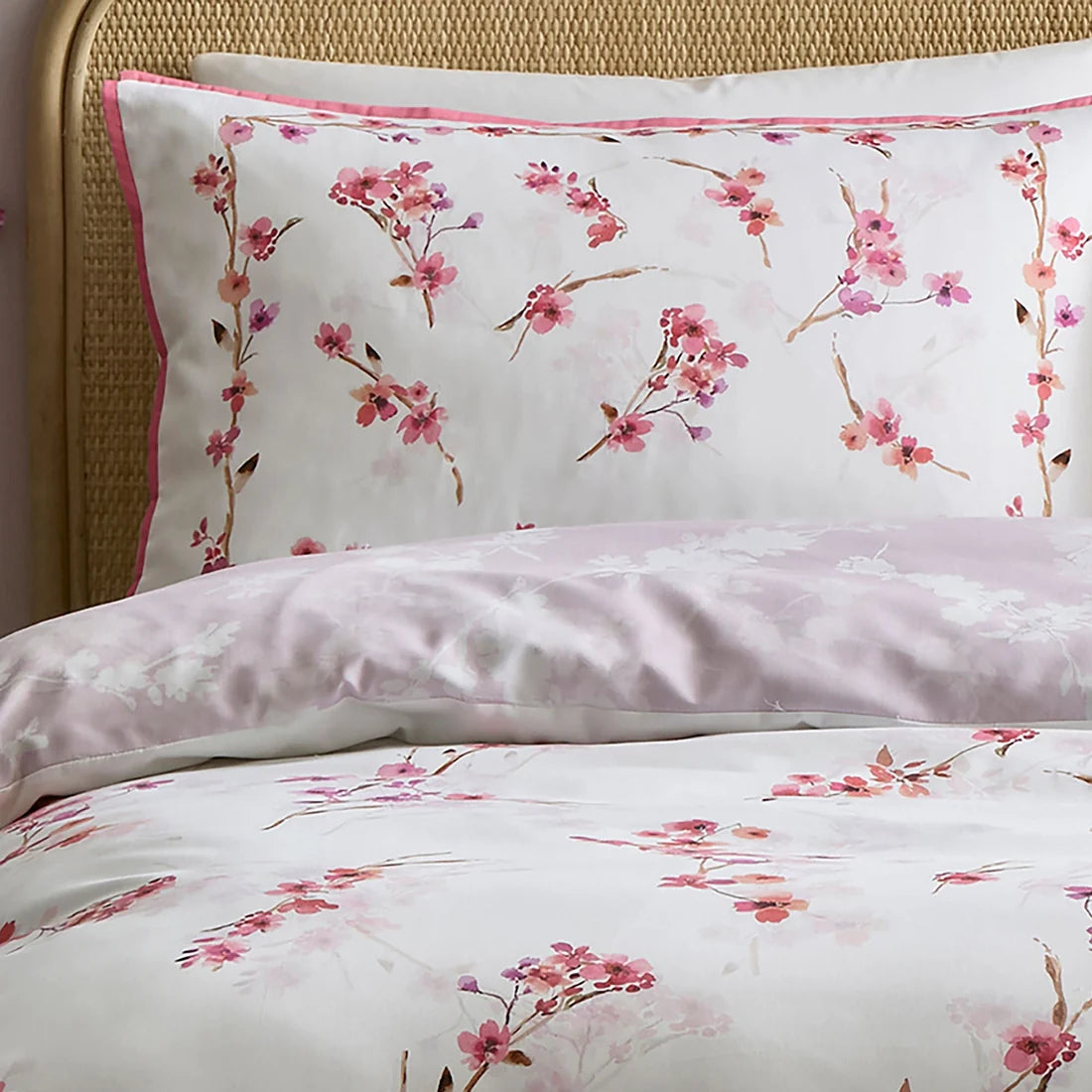 Close-up of the pink and berry blossom pattern on the Appletree Blossom Flower bedding.