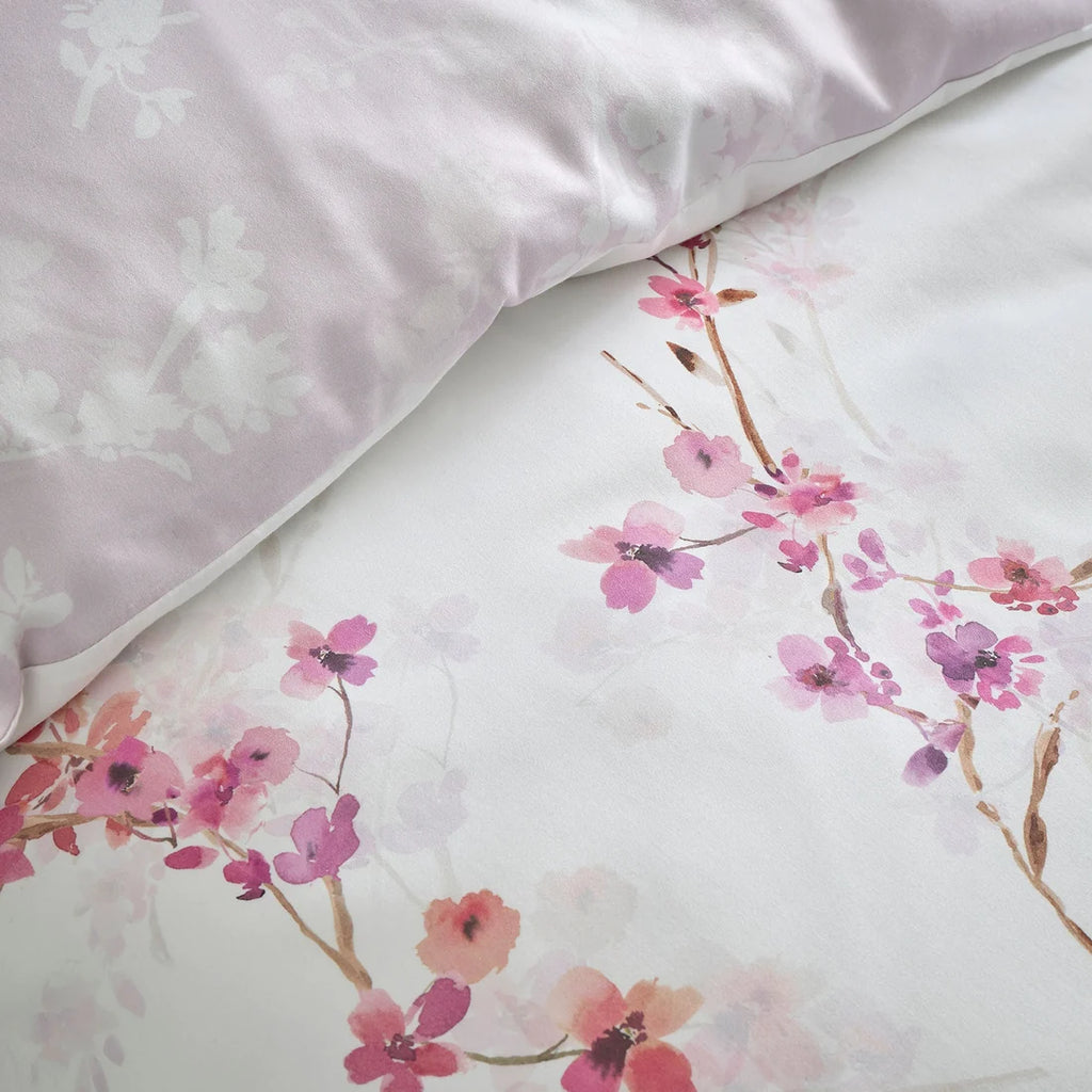 Close-up of the pink and berry blossom pattern on the Appletree Blossom Flower bedding.