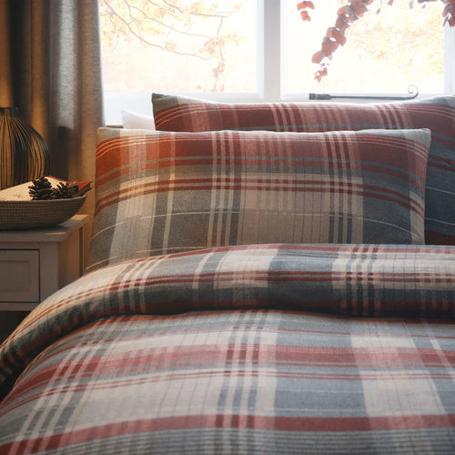 Close-up of the country check pattern and woodland stag design on the Appletree Connolly duvet cover set.
