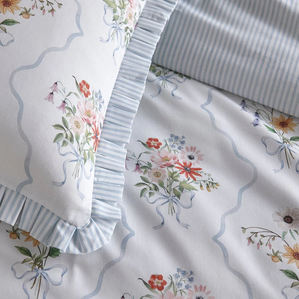 Close-up of the soft 100% cotton fabric with box pleat edging on the Appletree Floral Bouquet duvet cover set.