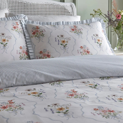 Close-up of the hand-painted floral bouquet and powder blue trellis design on the Appletree Floral Bouquet duvet cover set.