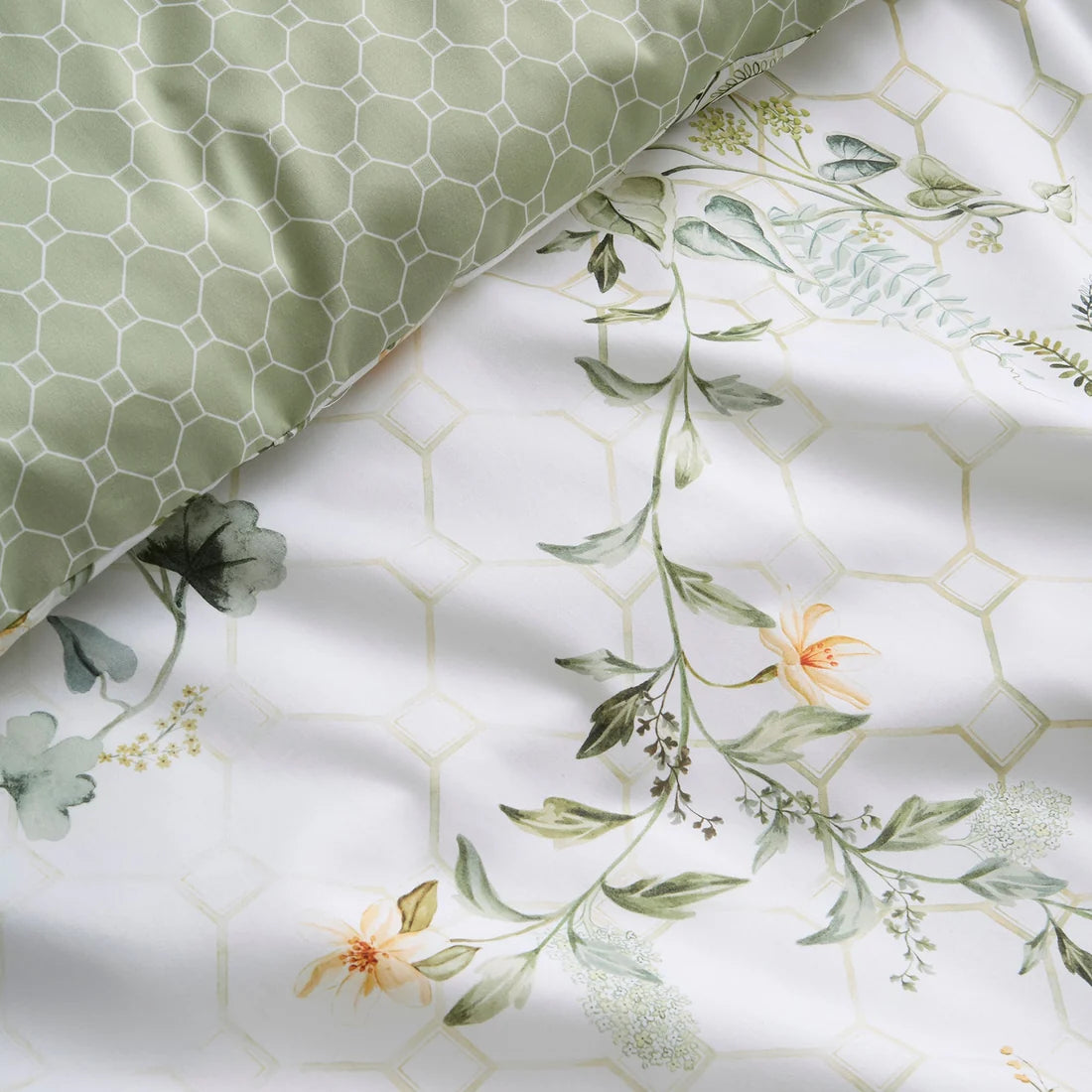 Close-up of the luxurious 200 thread count cotton sateen fabric and flat piped edging on the Appletree Floral Trellis duvet cover set.