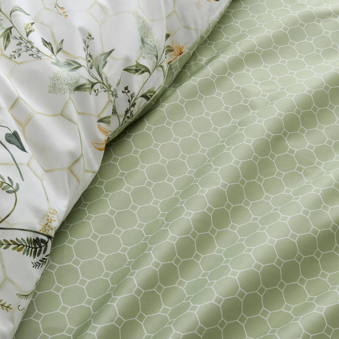 Close-up of the luxurious 200 thread count cotton sateen fabric and flat piped edging on the Appletree Floral Trellis duvet cover set.