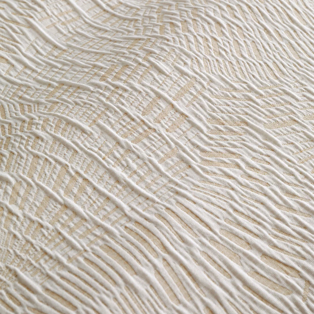 Close-up of the woven textured jacquard finish on the Appletree Fossil Jacquard duvet cover set.