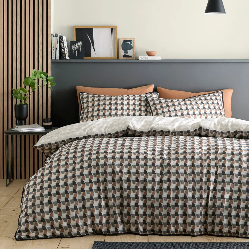 Appletree Jett reversible cotton duvet cover set in brown and bracken with geometric design.
