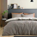 Appletree Jett reversible cotton duvet cover set in brown and bracken with geometric design.