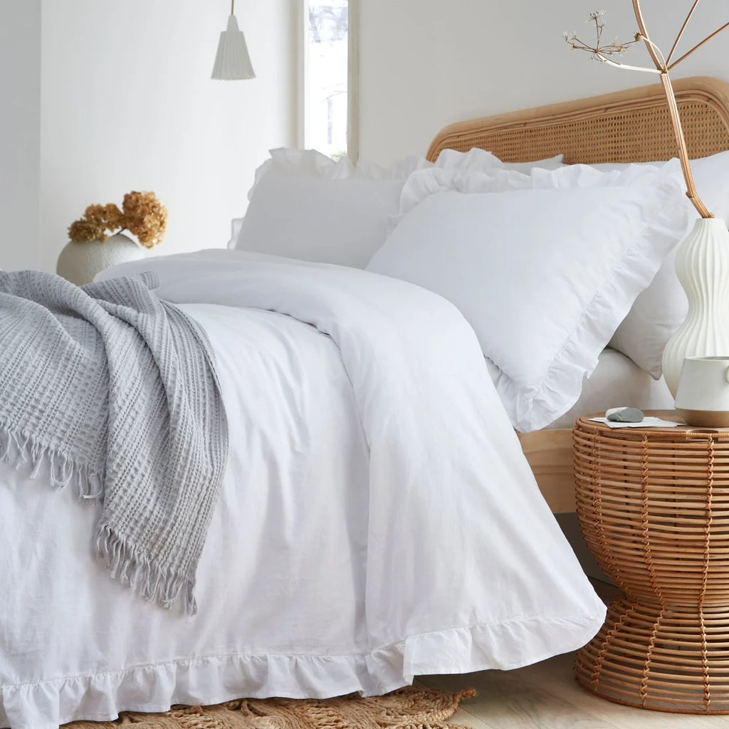 Close-up of the elegant frilled border on the Appletree Loft Cassia Frill duvet cover set.