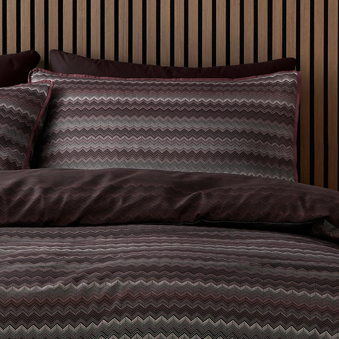 Close-up of the fine chevron pattern on the Appletree Loft Chevron Stripe Chocolate bedding.