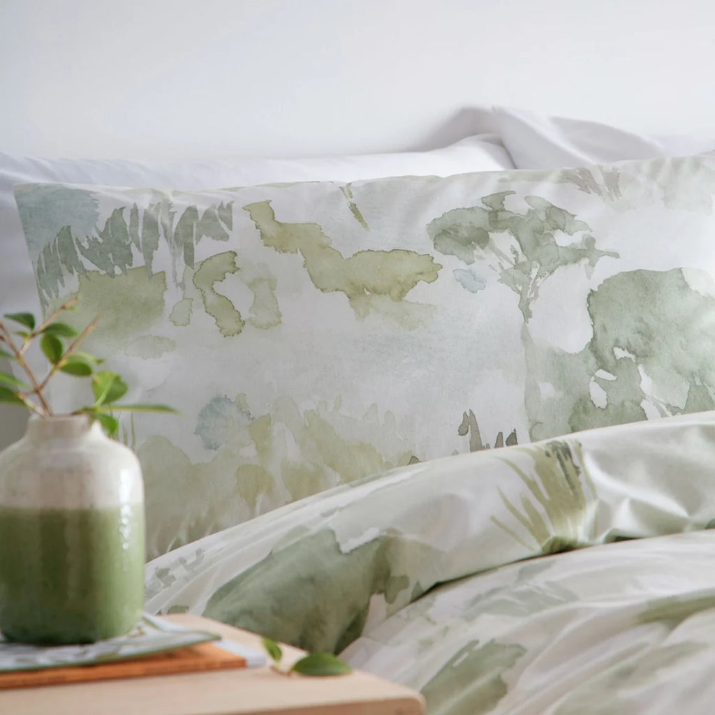 Close-up of the watercolour landscape design on the Appletree Loft Edale duvet cover set.