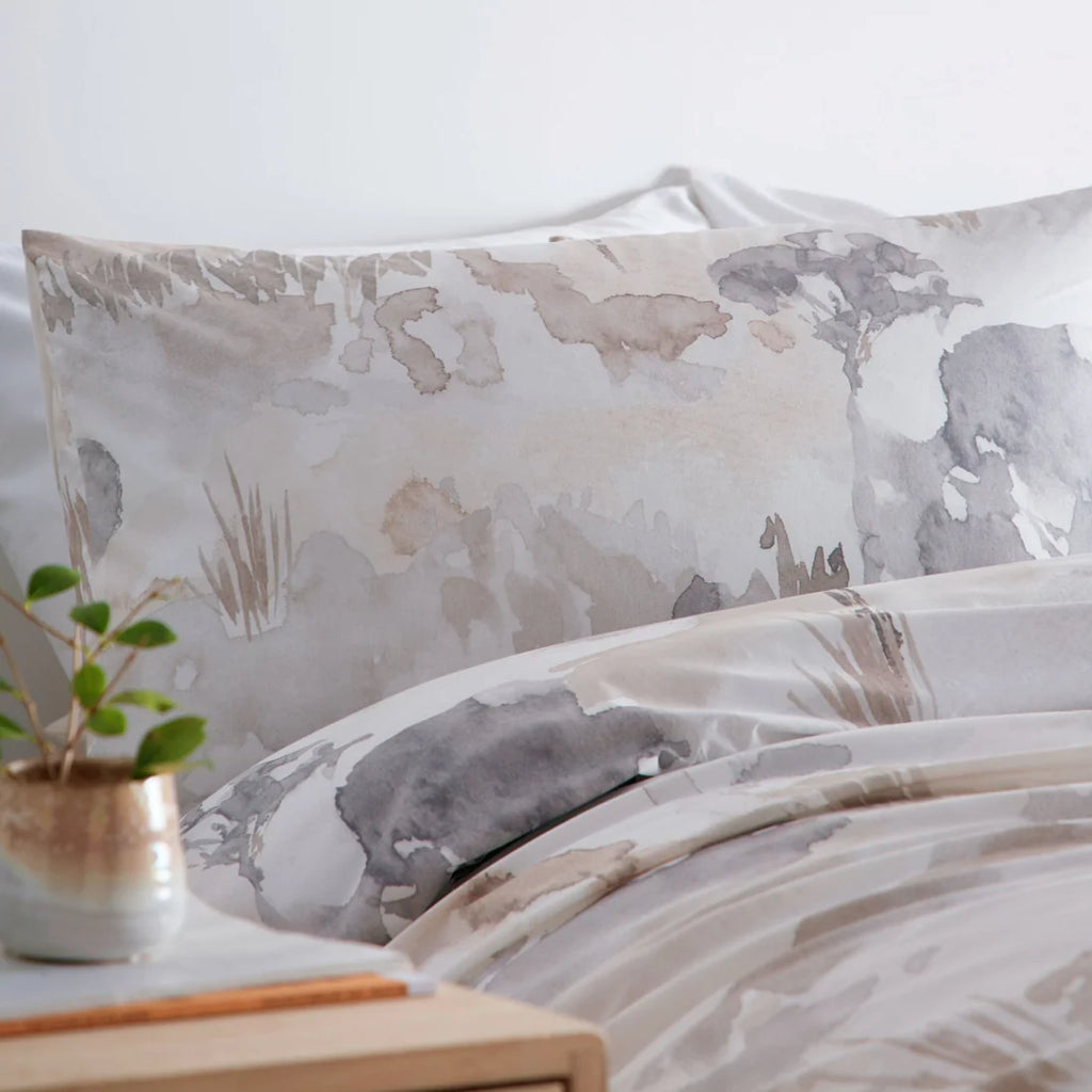 Close-up of the watercolour landscape design on the Appletree Loft Edale duvet cover set.