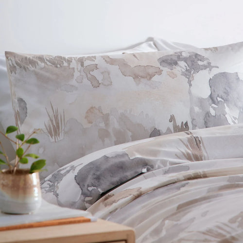 Close-up of the watercolour landscape design on the Appletree Loft Edale duvet cover set.