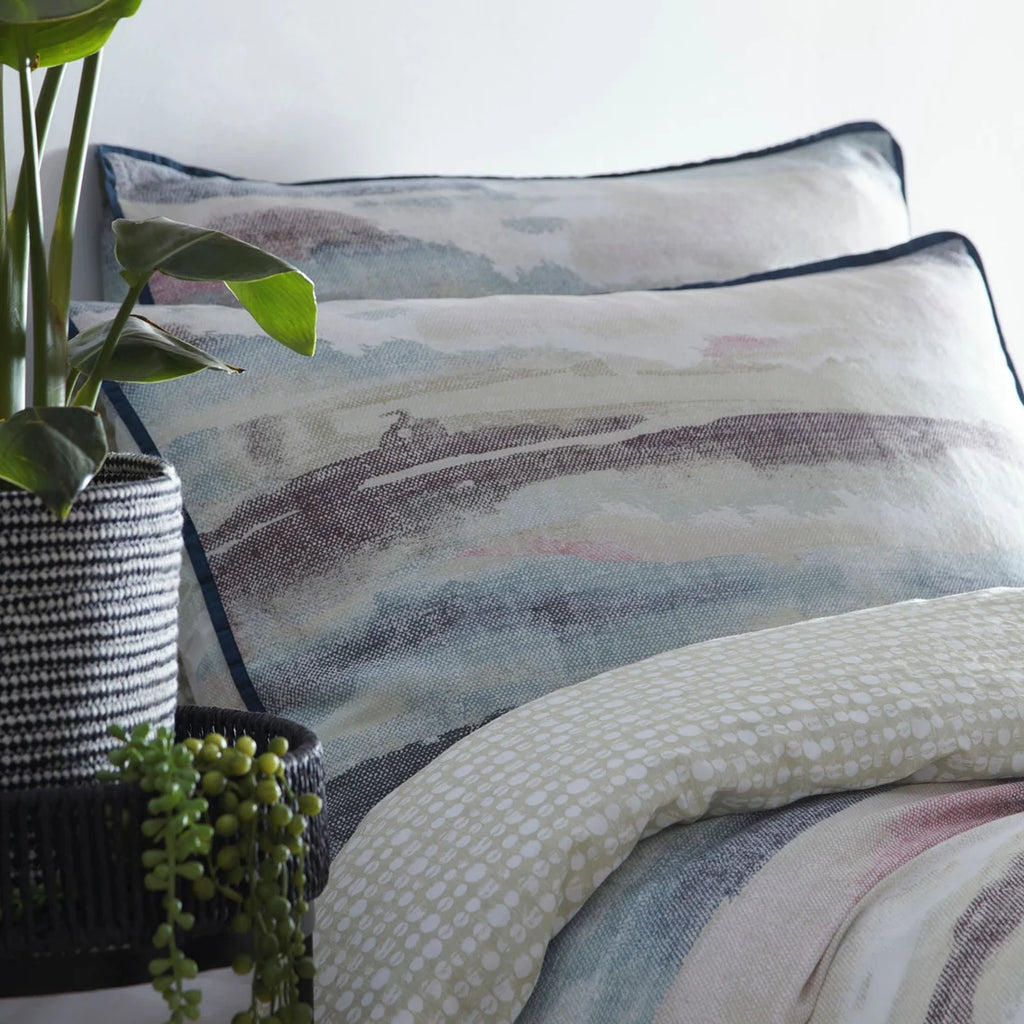 Close-up of the watercolour-inspired coastal print on the Appletree Loft Landscape duvet cover set.
