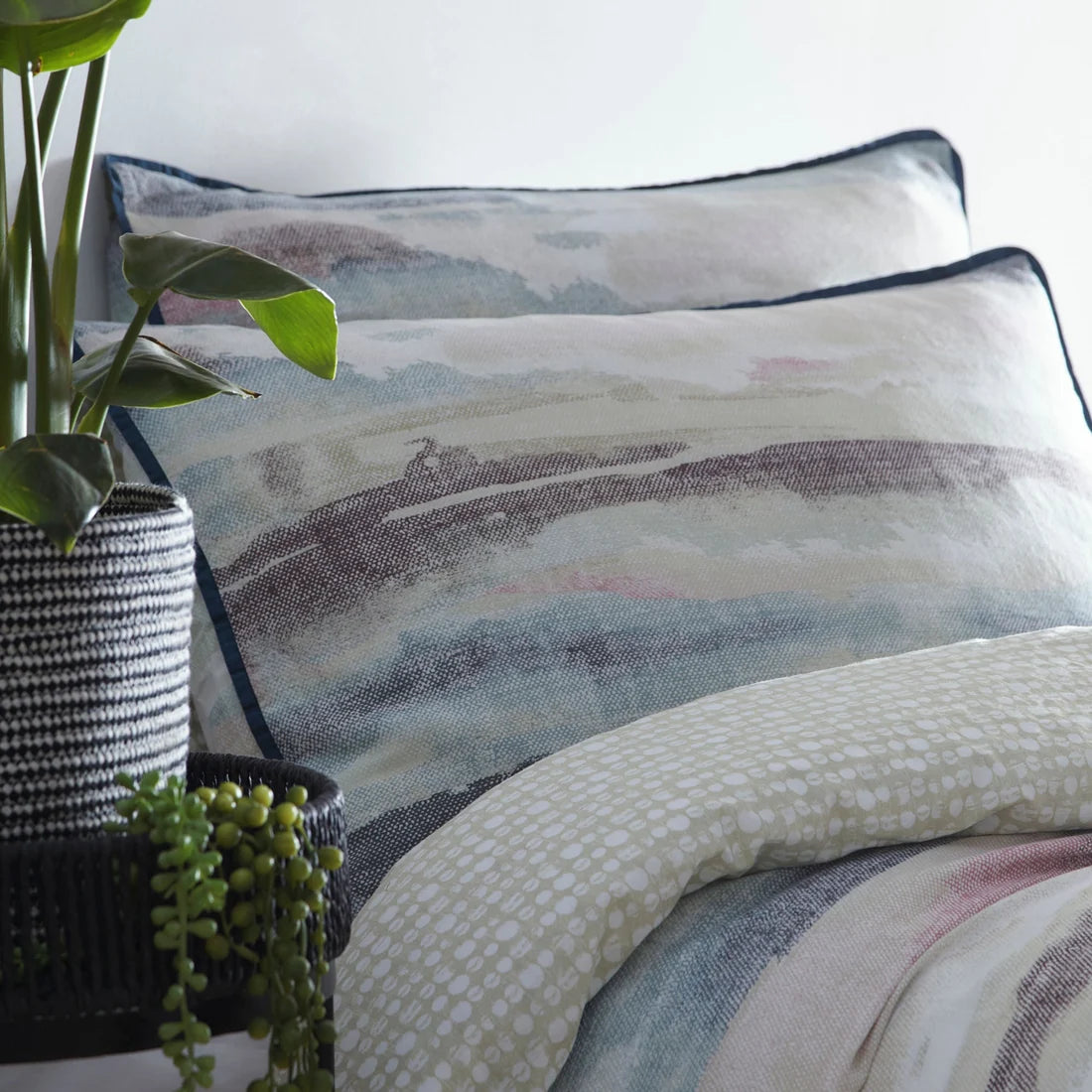 Close-up of the watercolour-inspired coastal print on the Appletree Loft Landscape duvet cover set.