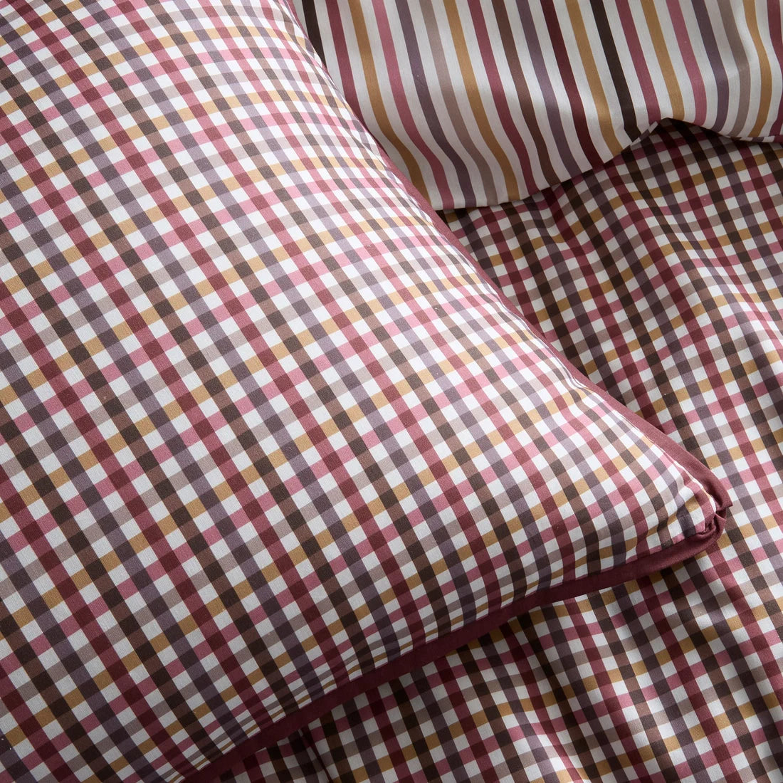 Close-up of the soft 100% cotton fabric and flat piped edging on the Appletree Micro Check duvet cover set.