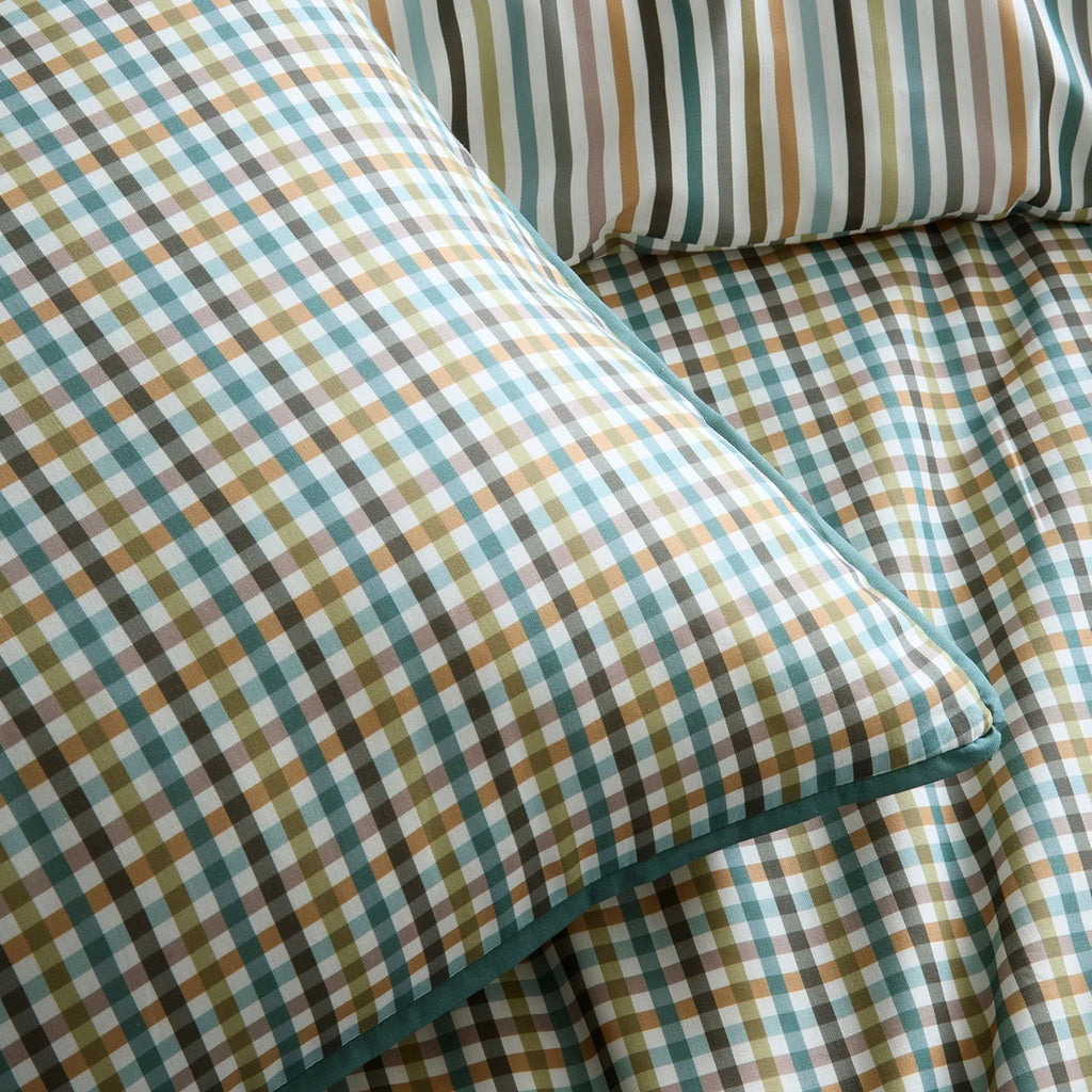 Close-up of the soft 100% cotton fabric and flat piped edging on the Appletree Micro Check duvet cover set.