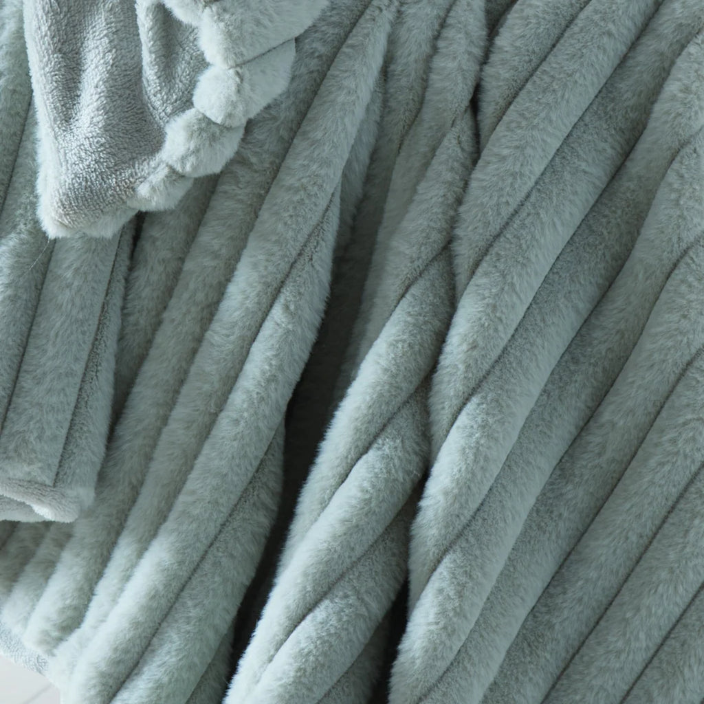 Close-up of the ribbed texture on the Appletree Morritz green throw.