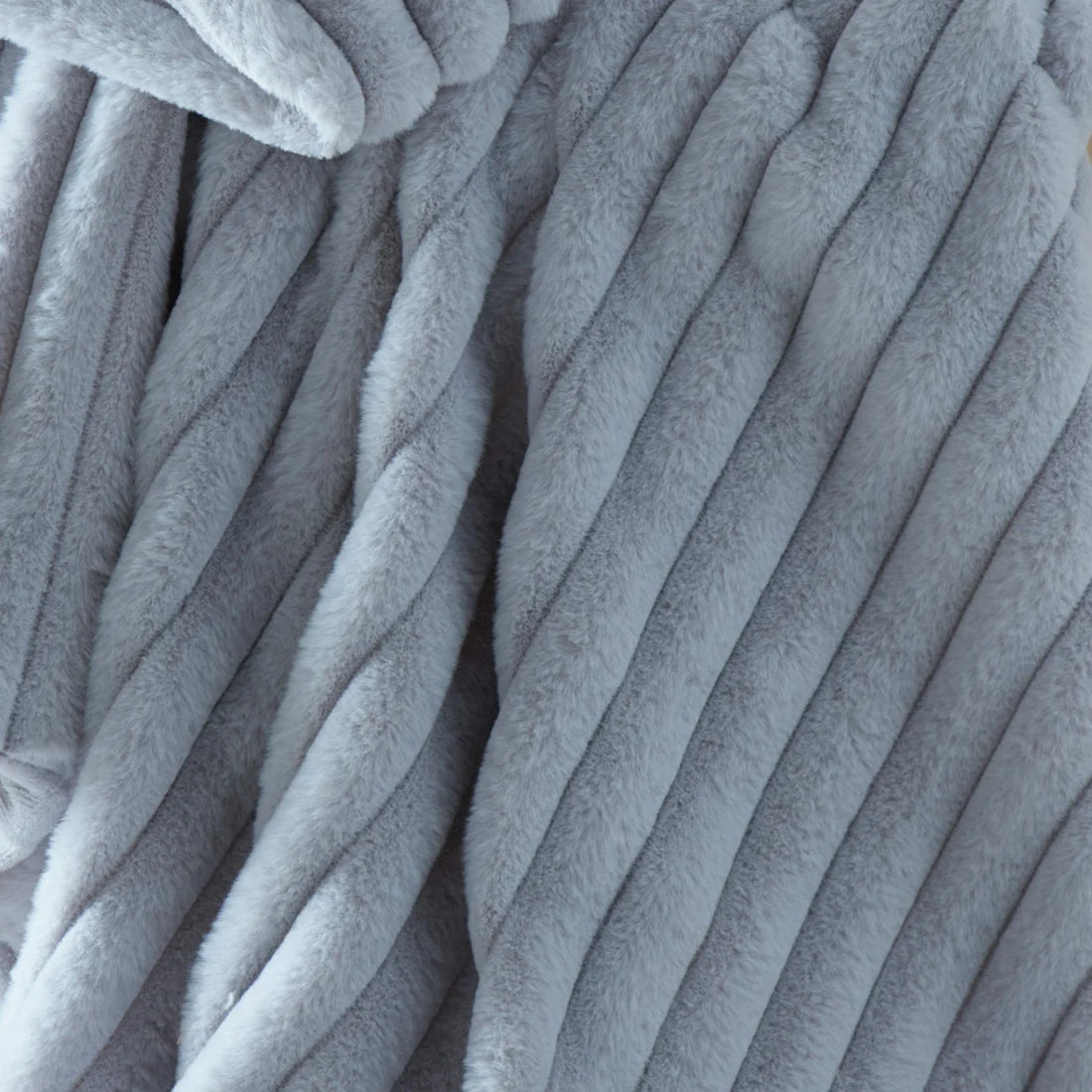 Close-up of the ribbed texture on the Appletree Morritz grey throw.