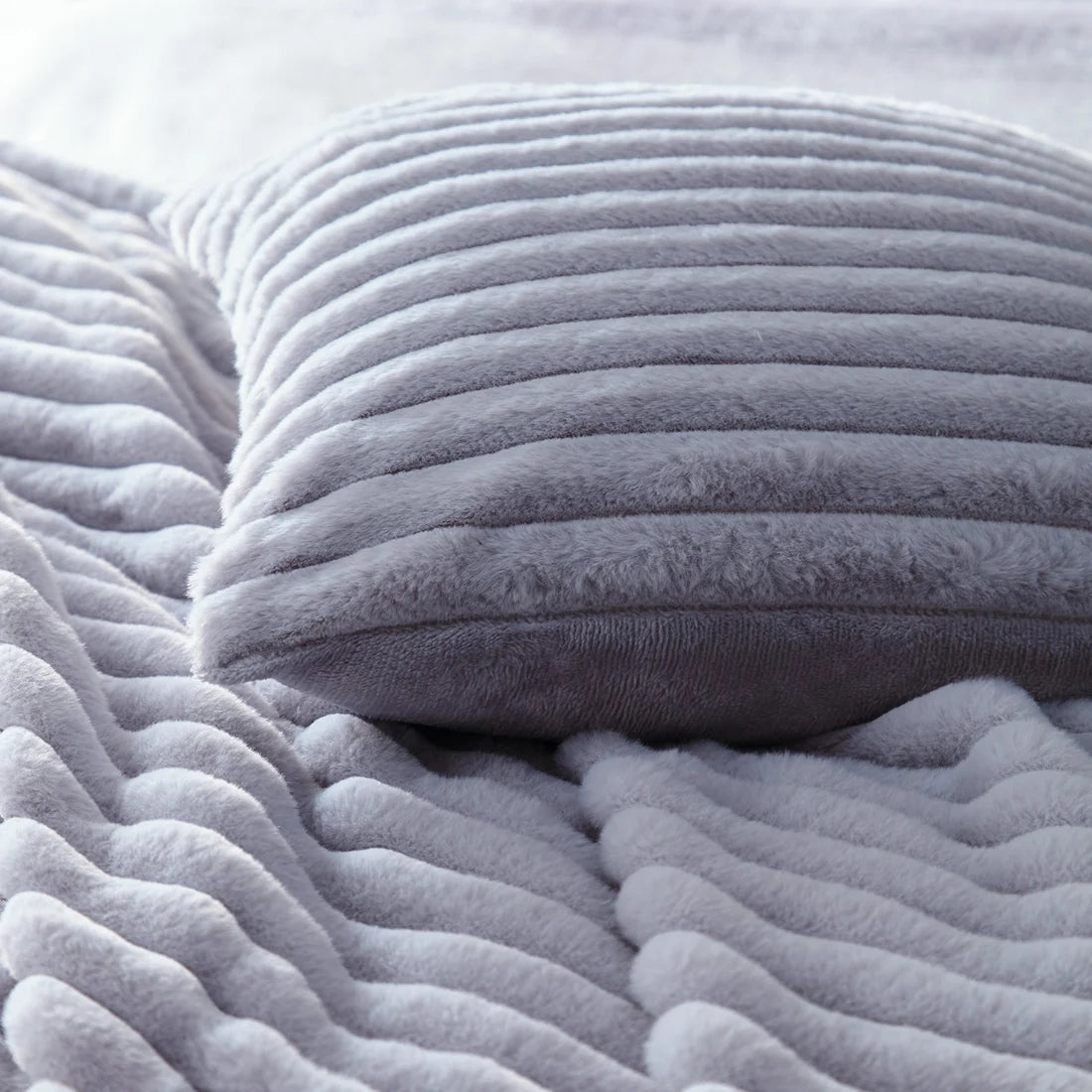 Close-up of the soft polyester fabric on the Appletree Morritz grey throw.
