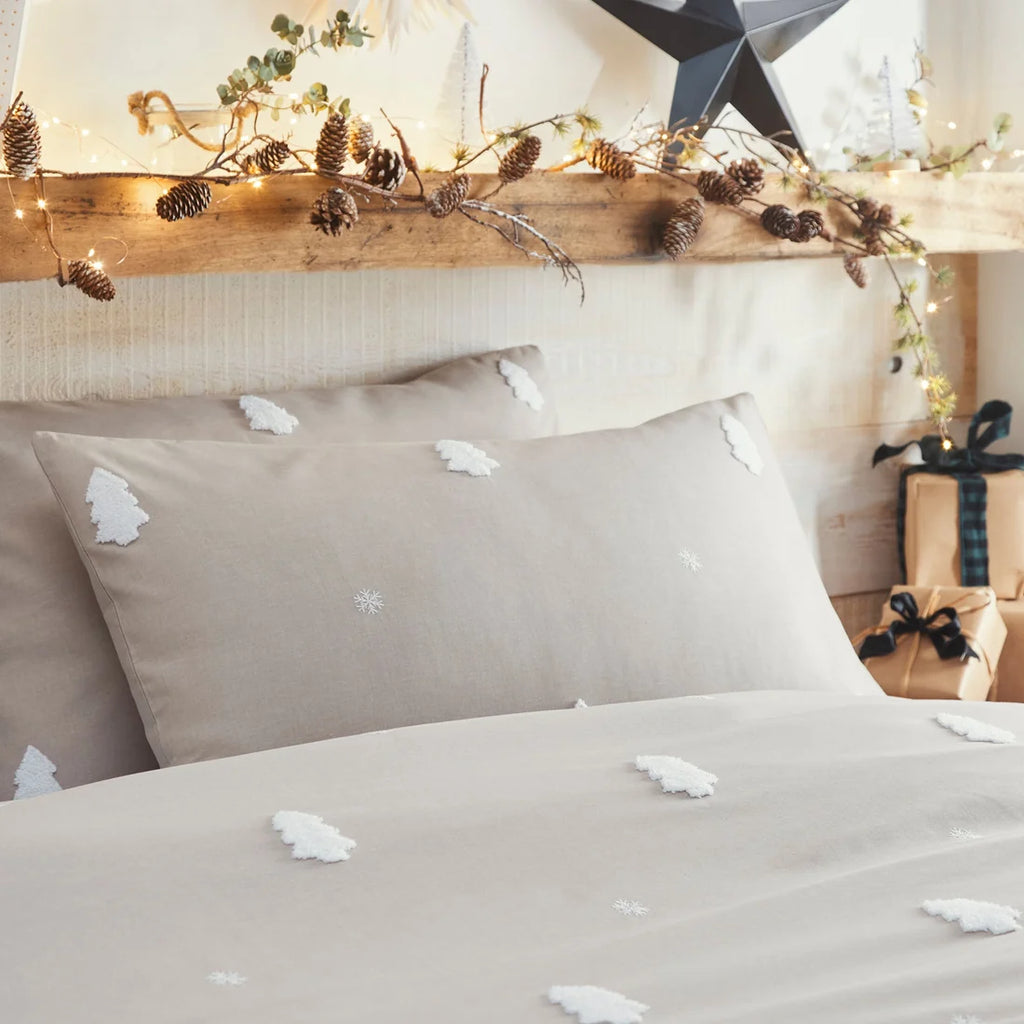 Close-up of the textured tufted Christmas trees on the Appletree Tufted Trees Natural bedding.