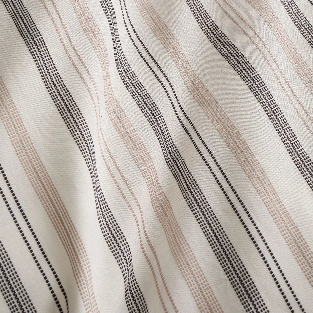 Close-up of the soft 100% cotton yarn-dyed woven fabric on the Appletree Thin Stripe duvet cover set.