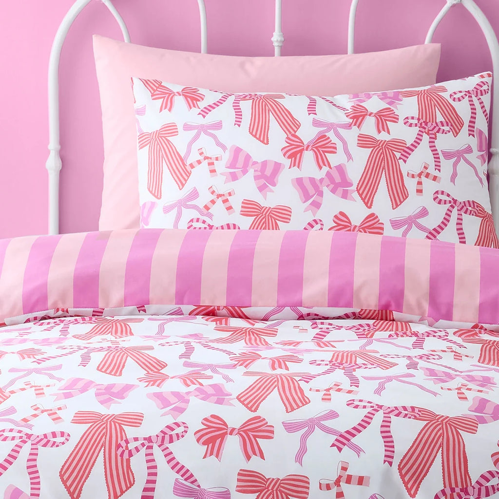 Close-up of the pink bow design on the Bedlam Bow and Stripes duvet cover set.