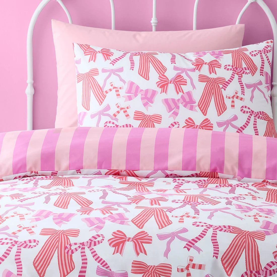 Close-up of the pink bow design on the Bedlam Bow and Stripes duvet cover set.