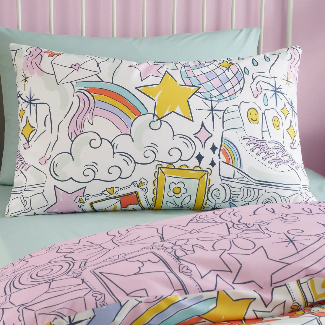 Close-up of the colourful stars, rainbows and playful doodles on the Bedlam Doodle Hobby duvet cover set.