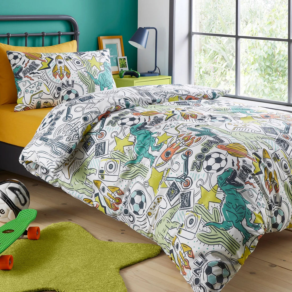 Children's bedroom with colorful bedding featuring dinosaurs and sports items.