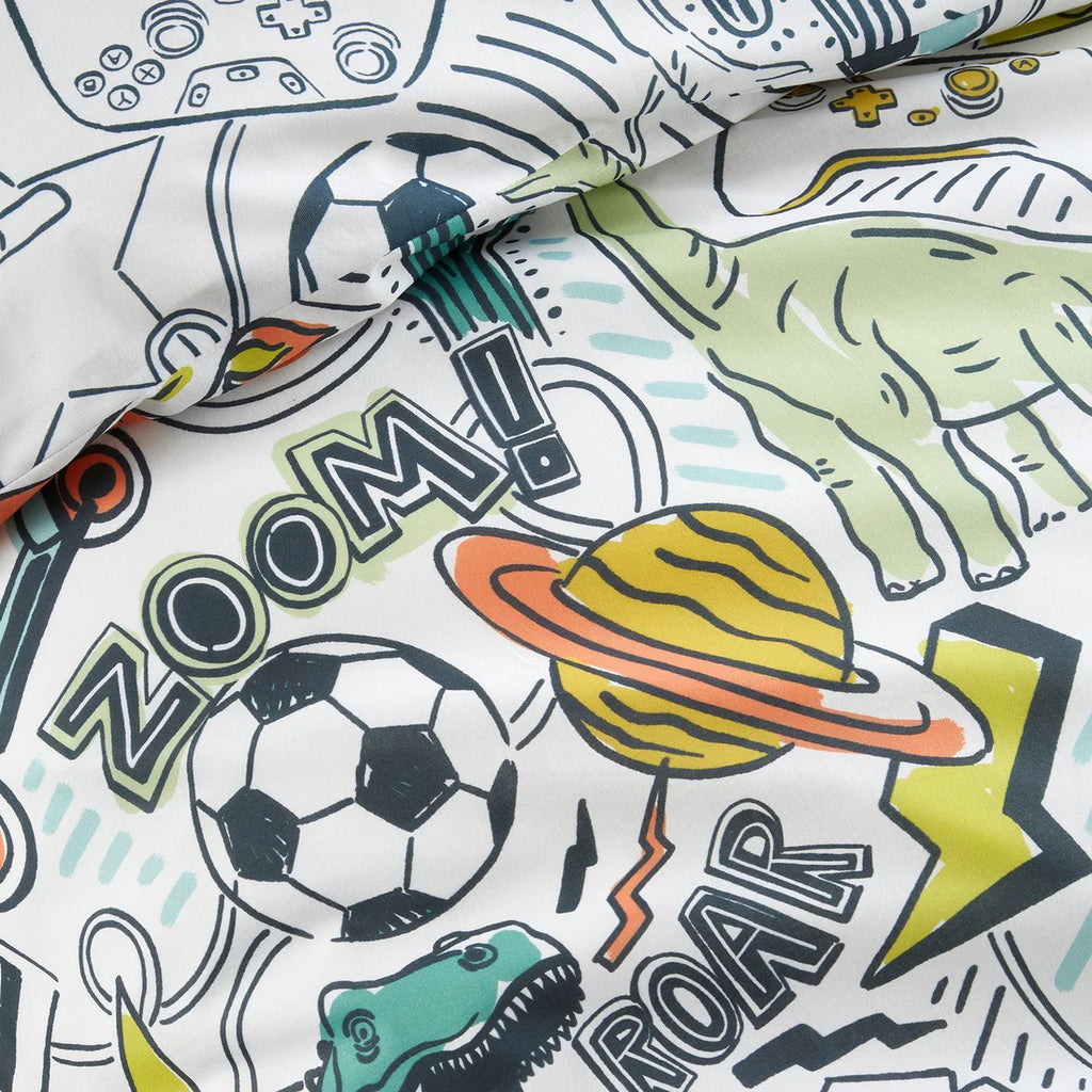 Children's fabric with sports-themed designs including a soccer ball, dinosaur, and space elements.