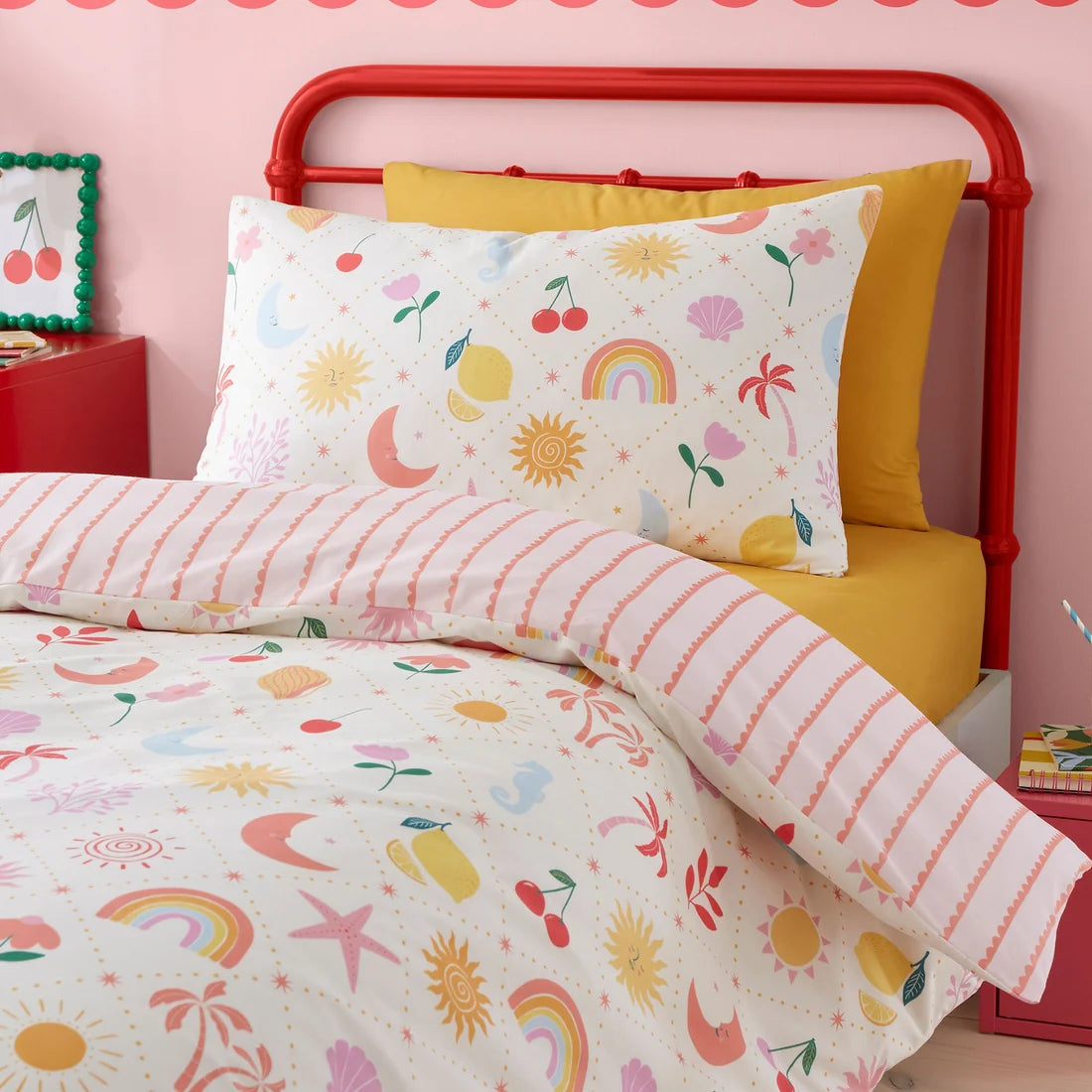 Close-up of the colourful sun, moon and rainbow design on the Bedlam Dreamscape duvet cover set.