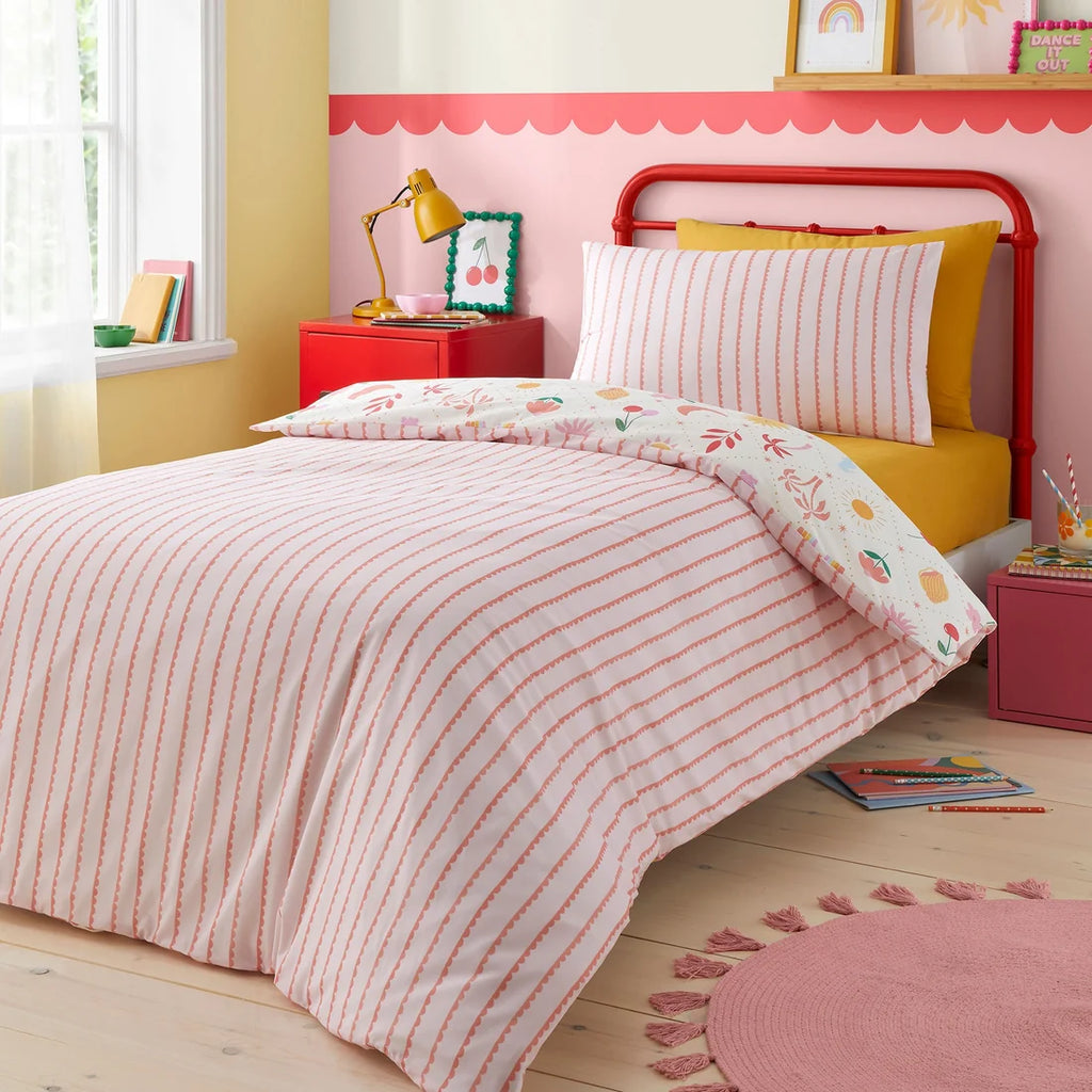 Close-up of the colourful sun, moon and rainbow design on the Bedlam Dreamscape duvet cover set.