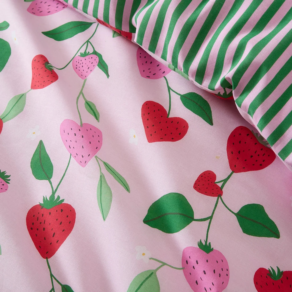 Close-up of the soft cotton-rich polycotton fabric on the Bedlam Fun Strawberries duvet cover set.