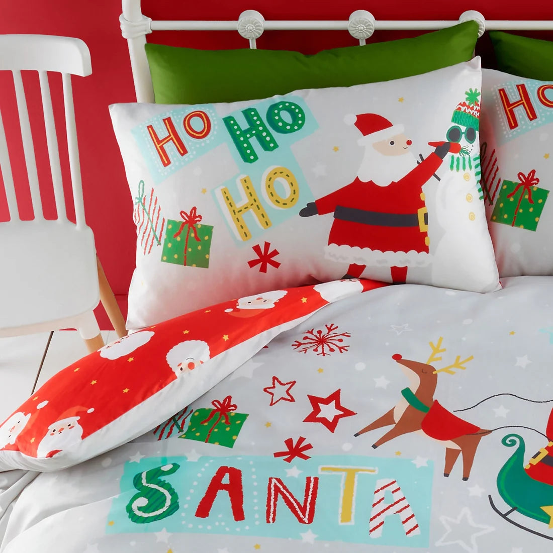 Close-up of the Santa Please Stop Here festive design on the Bedlam duvet cover set.