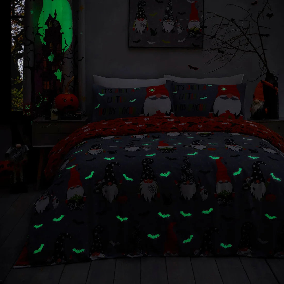 Close-up of the glow in the dark Halloween gonk design on the Bedlam Scary Gonks duvet cover set.
