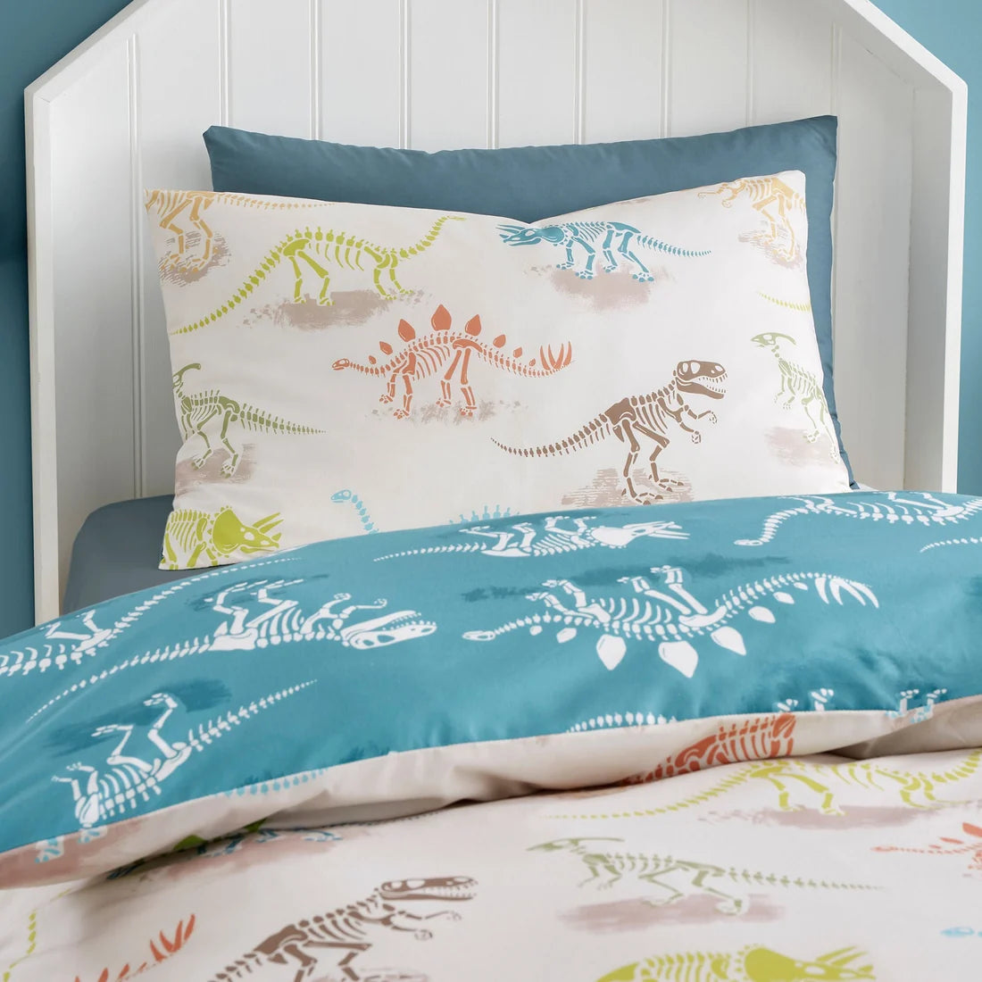 Close-up of the colourful dinosaur skeleton design on the Bedlam Skeleton Dino duvet cover set.