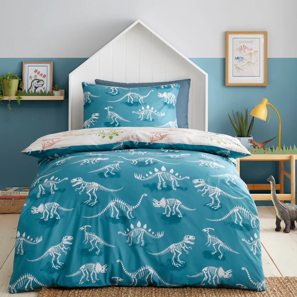 Teal jungle reverse featuring dinosaur skeletons on the Bedlam Skeleton Dino duvet cover set.