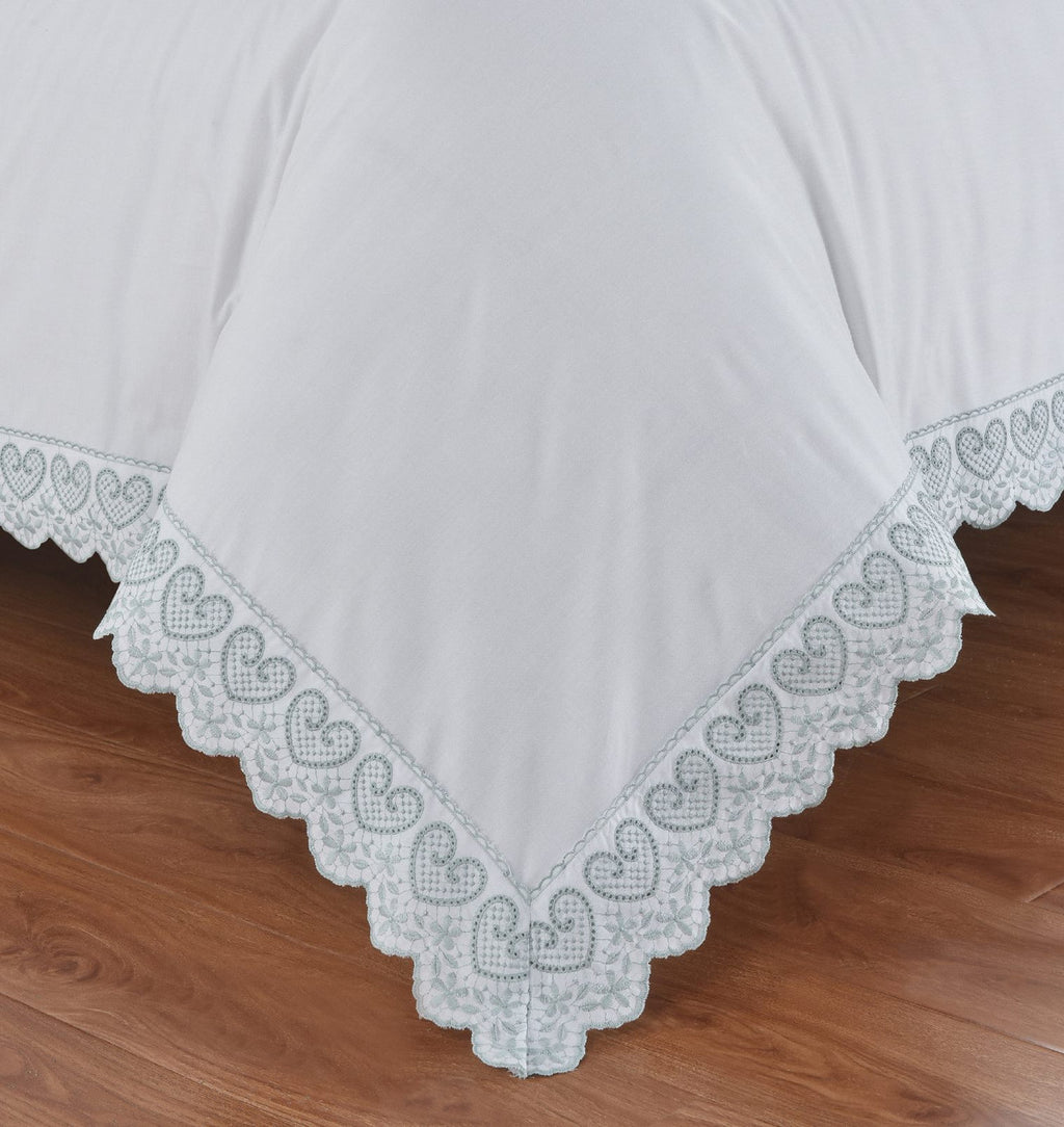 Close-up of the heart-shaped embroidery and lace trim on the Belle Maison Elise duvet cover set.