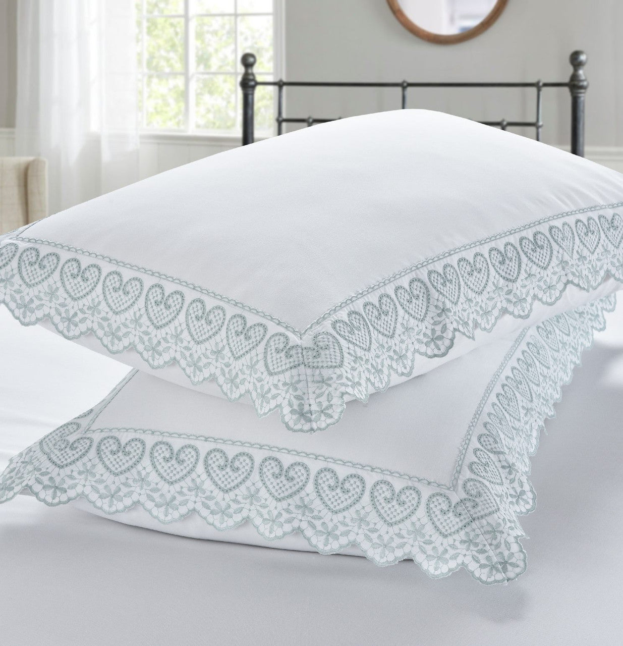 Belle Maison Elise embroidered pillowcases with elegant heart embroidery and lace edging.