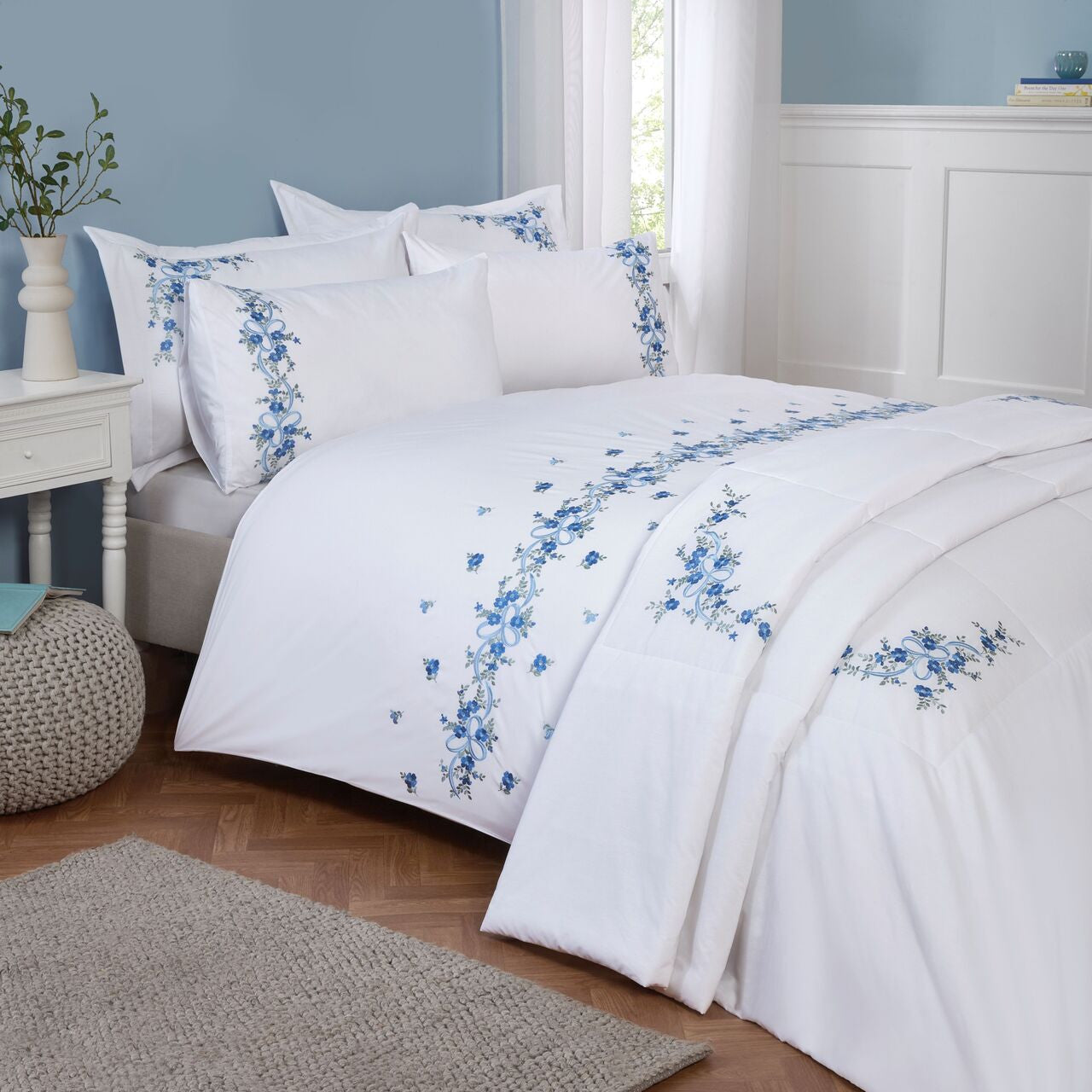 Belle Maison Floral Ribbon embroidered duvet cover set styled with bedspread with elegant floral detailing.