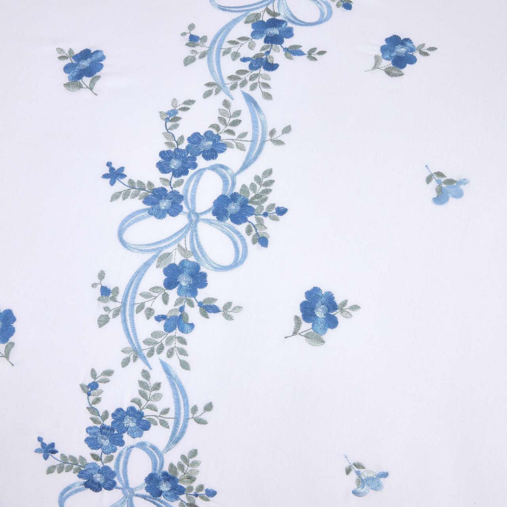 Close-up of the floral ribbon embroidery on the Belle Maison duvet cover set.