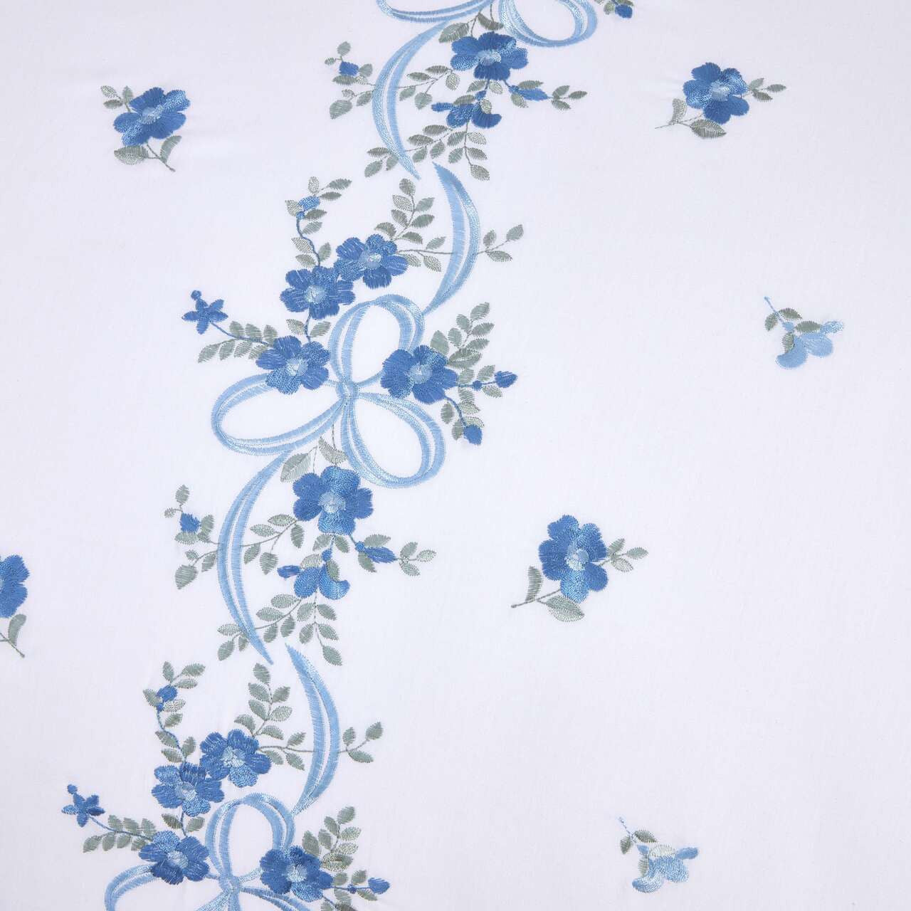Close-up of the floral ribbon embroidery on the Belle Maison duvet cover set.