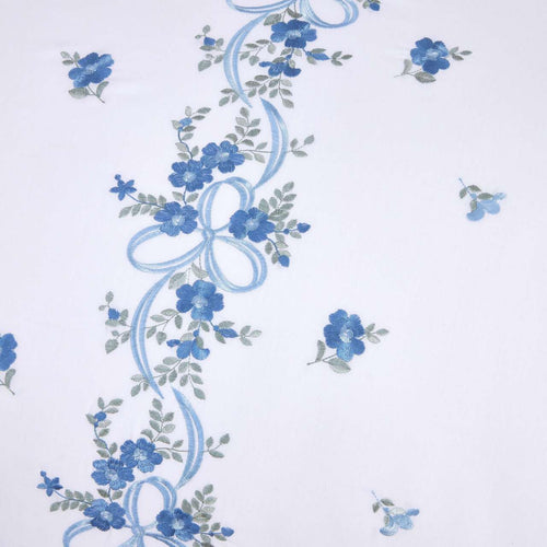 Close-up of the floral ribbon embroidery on the Belle Maison duvet cover set.