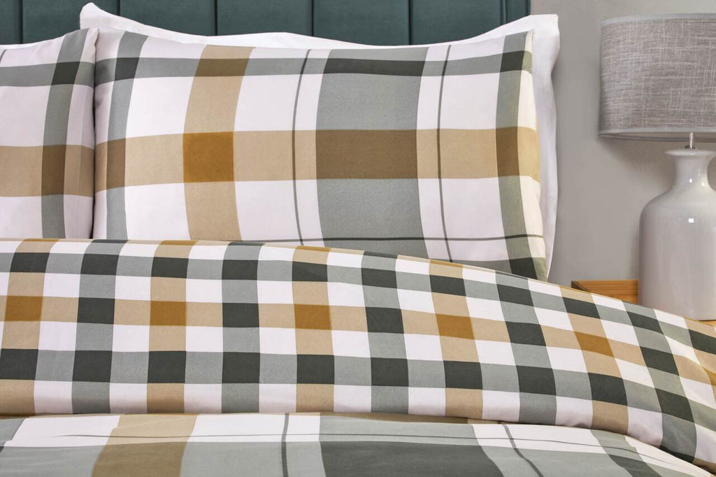 Close-up of the mustard yellow, olive green and white check pattern on the Braemar duvet cover set.