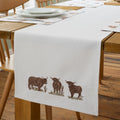 Catherine Lansfield Angus Highland Cow Cotton Dining Table Runner in Natural